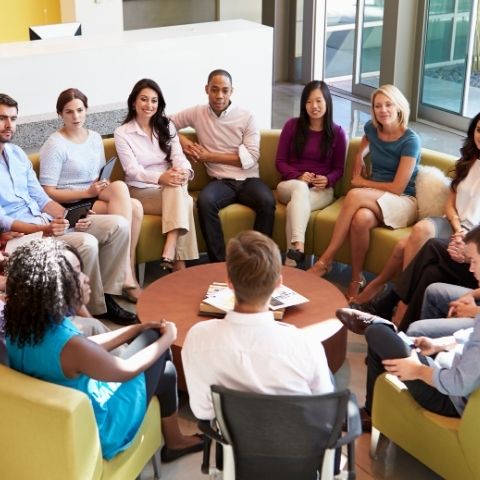 Work team sitting in circle